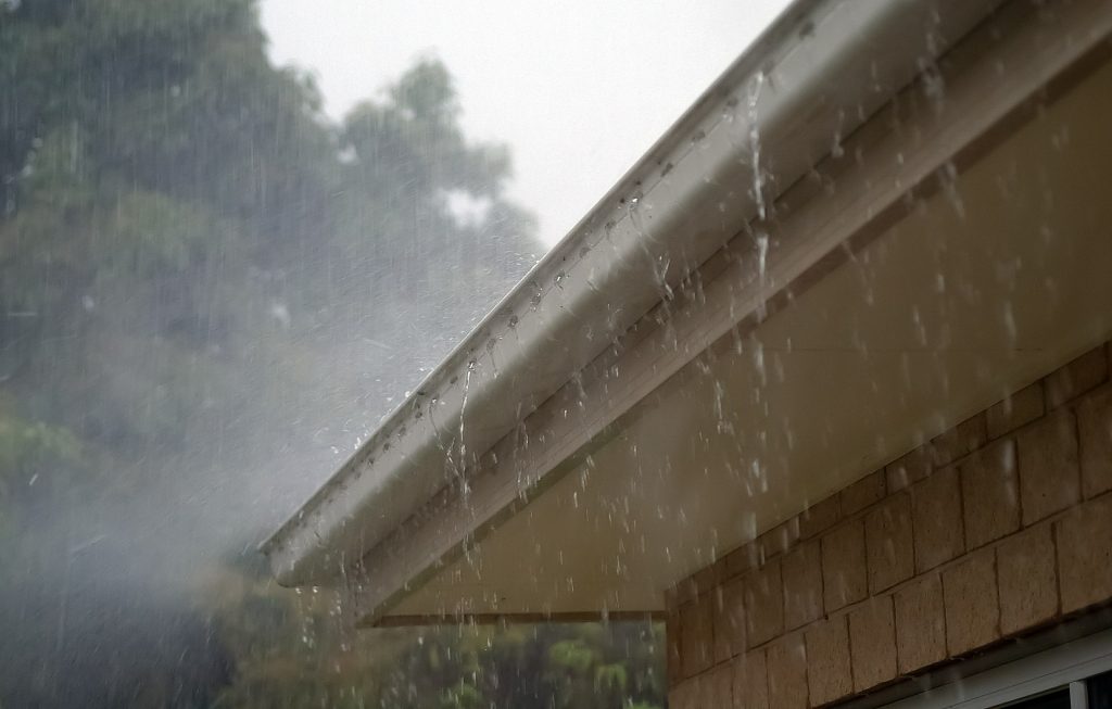 home in a downpour of rain