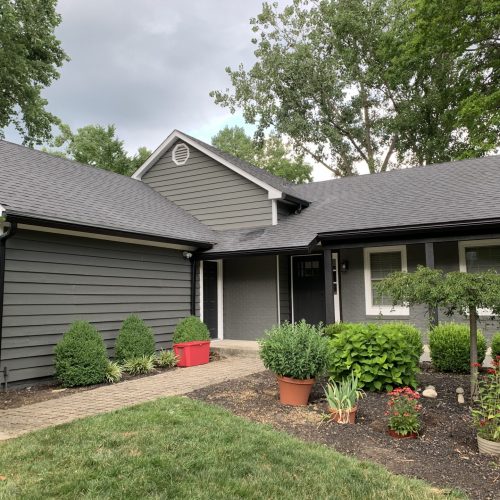 dark gray house and yard