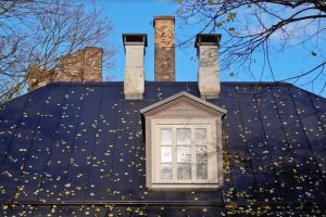 Roof of house with window in the center