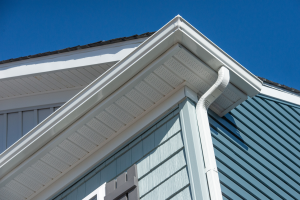 White gutters and blue siding