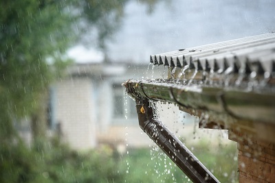Rain dripping down gutter seams