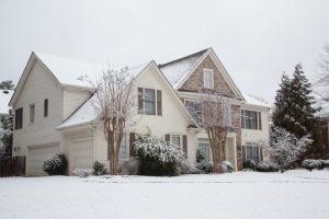 Suburban house dusted with snow